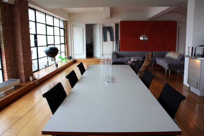 Large dinning room in converted warehouse apartment