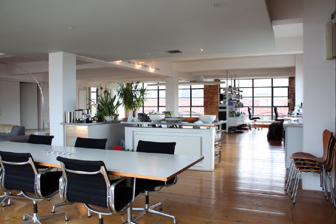 Large dinning room in converted warehouse apartment