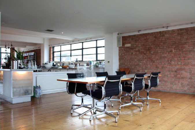 Large dinning room in converted warehouse apartment