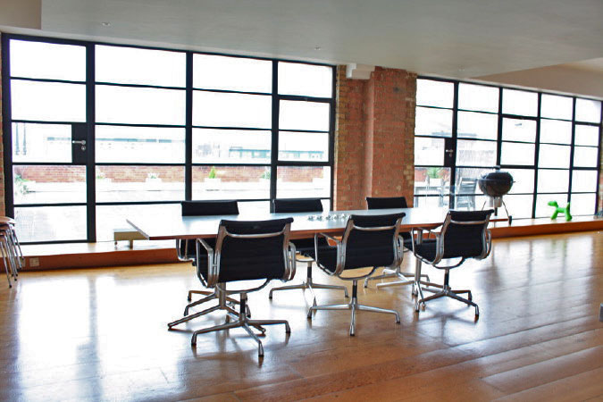 Large dinning room in converted warehouse apartment