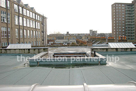 Rooftop view above minimal apartment in east London. NB new building block has been erected. Ask office for more details.
