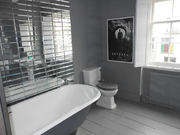 3,500 sq ft of space including a warehouse studio and darkroom behind spread over 4 floors of a townhouse with an eclectic mix of Georgian and Edwardian styles retaining original features.