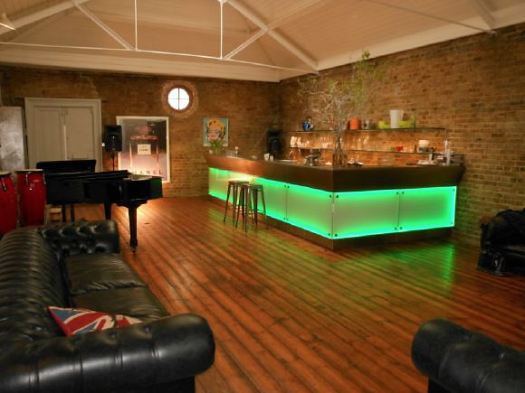 3,500 sq ft of space including a warehouse studio and darkroom behind spread over 4 floors of a townhouse with an eclectic mix of Georgian and Edwardian styles retaining original features.