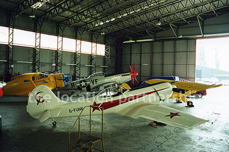 Aircraft Hanger with a number of small historic planes
