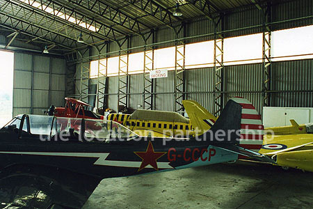 Aircraft Hanger with a number of small historic planes