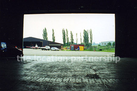 Aircraft Hanger with a number of small historic planes
