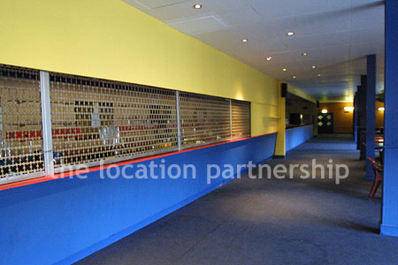 Large blue and yellow canteen, restaurant area at event venue