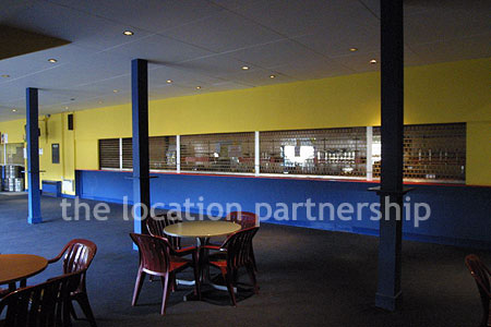 Large blue and yellow canteen, restaurant area at event venue