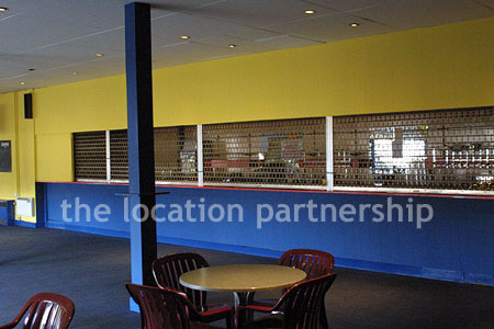 Large blue and yellow canteen, restaurant area at event venue
