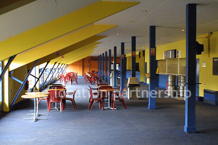 Large blue and yellow canteen, restaurant area at event venue