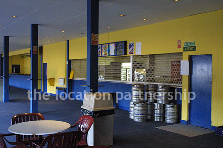 Large blue and yellow canteen, restaurant area at event venue