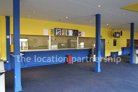 Large blue and yellow canteen, restaurant area at event venue