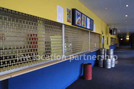Large blue and yellow canteen, restaurant area at event venue