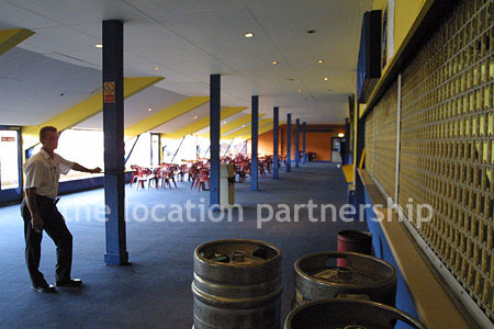 Large blue and yellow canteen, restaurant area at event venue