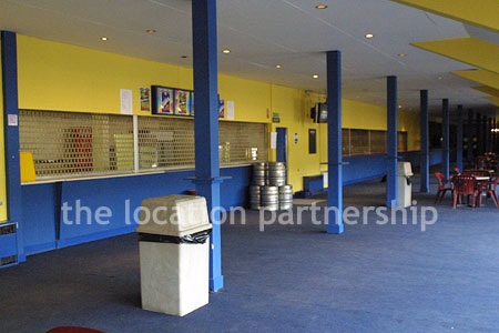 Large blue and yellow canteen, restaurant area at event venue