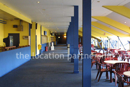 Large blue and yellow canteen, restaurant area at event venue