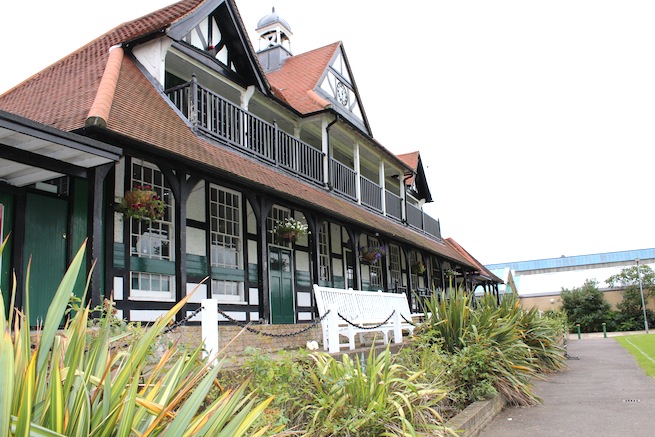 Lovely cricket pavilion built in 1886 filled with memorabilia inside. Listed building. Surrounded by cricket pitch and athletics track.
