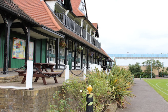 Lovely cricket pavilion built in 1886 filled with memorabilia inside. Listed building. Surrounded by cricket pitch and athletics track.