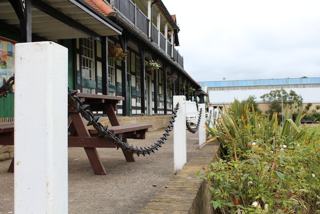 Lovely cricket pavilion built in 1886 filled with memorabilia inside. Listed building. Surrounded by cricket pitch and athletics track.