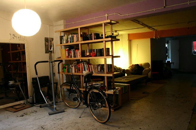 Workshop converted into a flat on one level with 4 bedrooms, concrete floors and exposed brick walls.