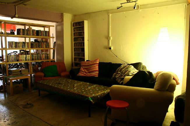 Workshop converted into a flat on one level with 4 bedrooms, concrete floors and exposed brick walls.