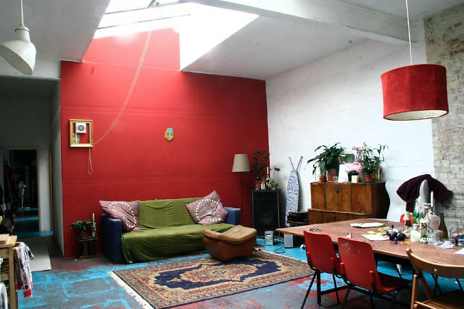 Workshop converted into a flat on one level with 4 bedrooms, concrete floors and exposed brick walls.