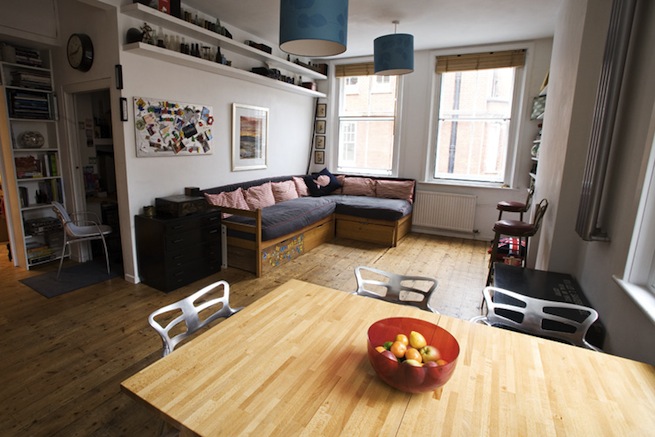 Bright, modern flat with wooden floors and open kitchen and living areas.