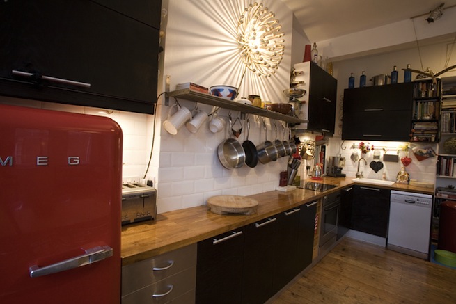 Bright, modern flat with wooden floors and open kitchen and living areas.