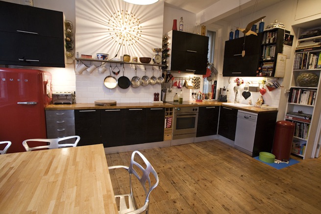 Bright, modern flat with wooden floors and open kitchen and living areas.