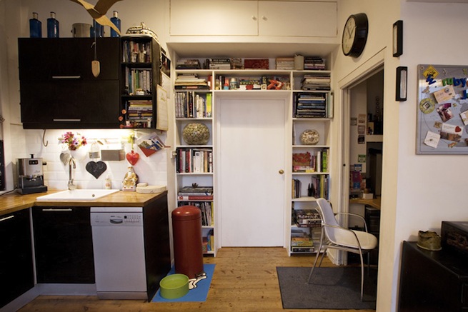 Bright, modern flat with wooden floors and open kitchen and living areas.