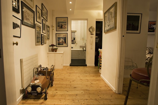 Bright, modern flat with wooden floors and open kitchen and living areas.