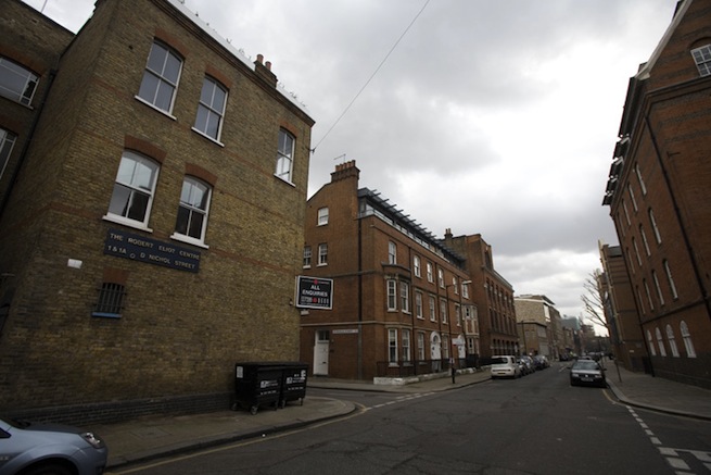Bright, modern flat with wooden floors and open kitchen and living areas.