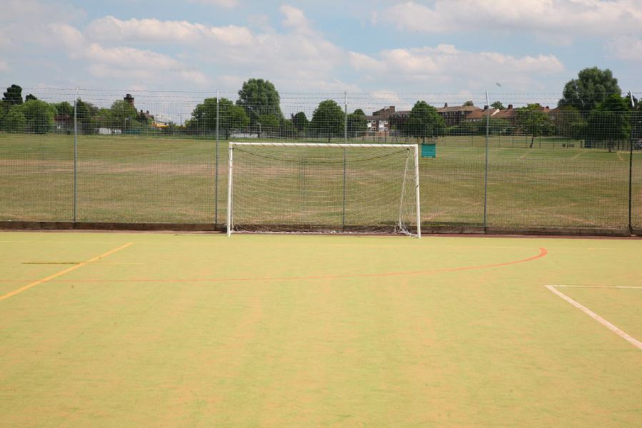 Astro pitches with a suburban backdrop