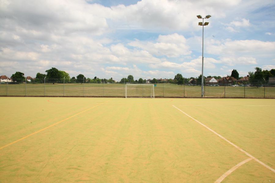 Astro pitches with a suburban backdrop