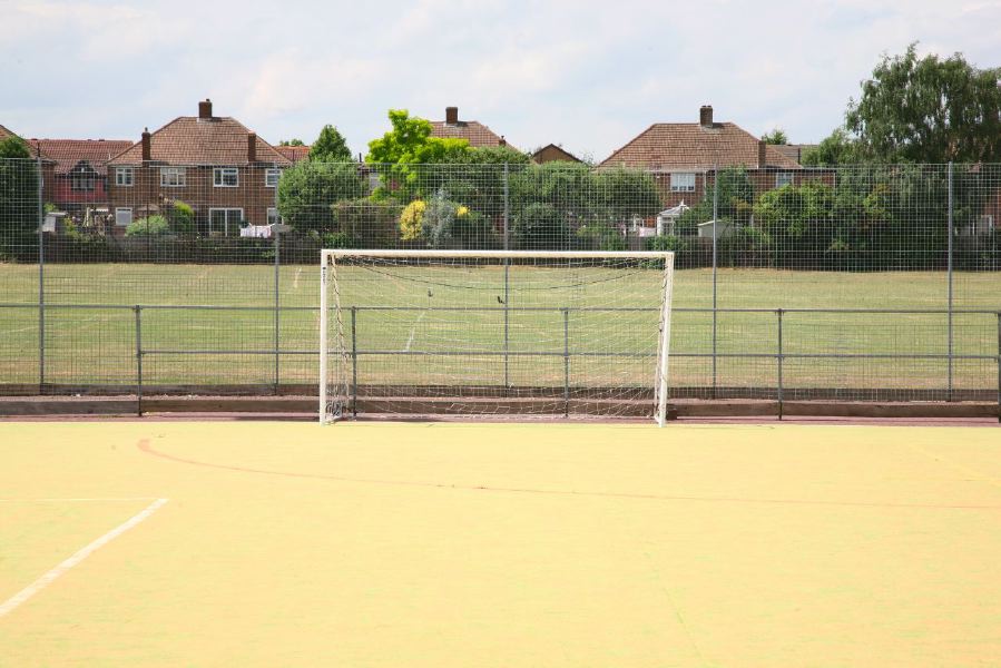 Astro pitches with a suburban backdrop