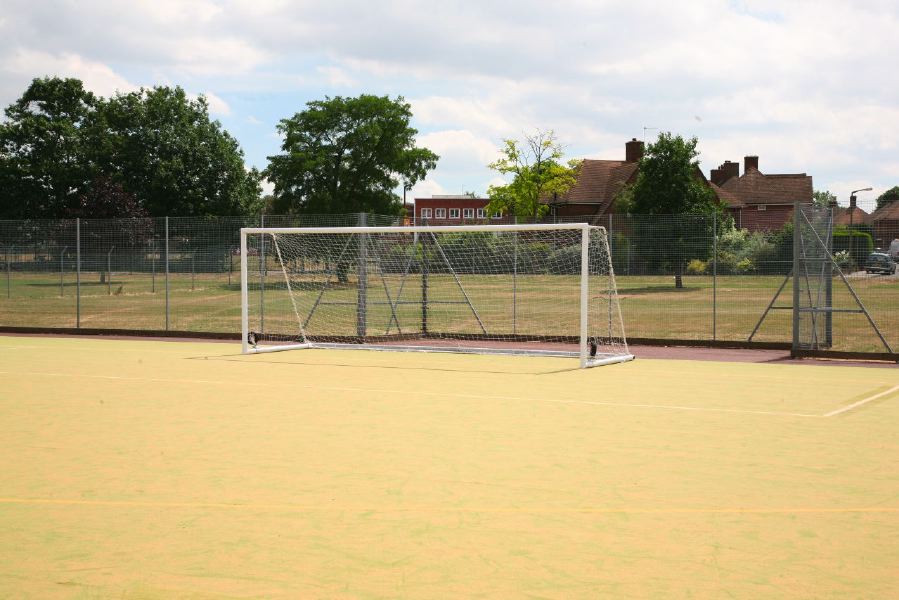 Astro pitches with a suburban backdrop