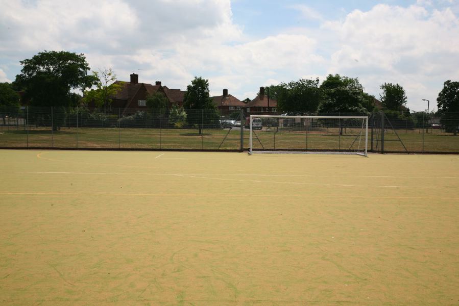 Astro pitches with a suburban backdrop