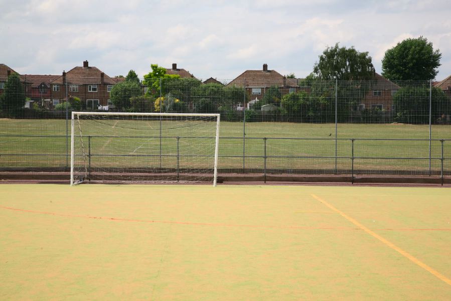 Astro pitches with a suburban backdrop