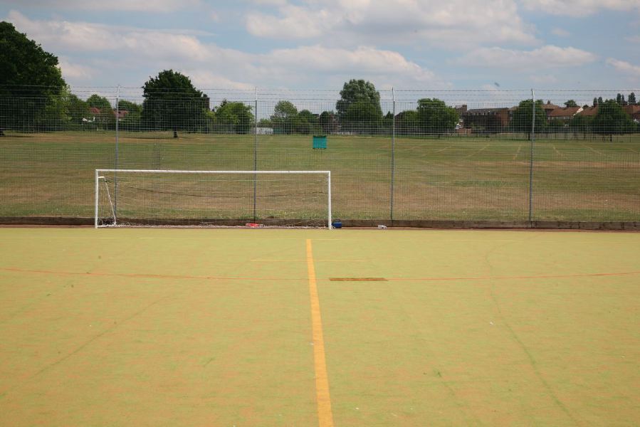 Astro pitches with a suburban backdrop