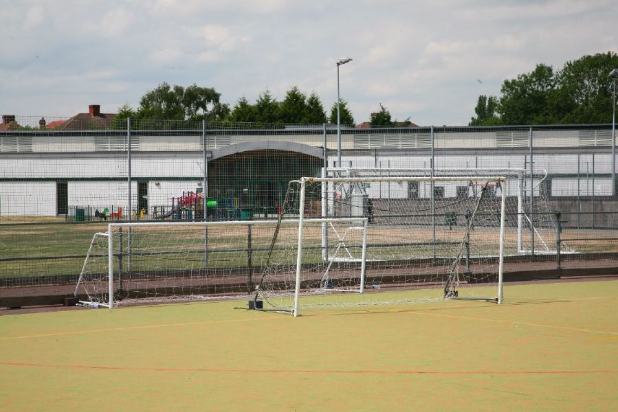 Astro pitches with a suburban backdrop