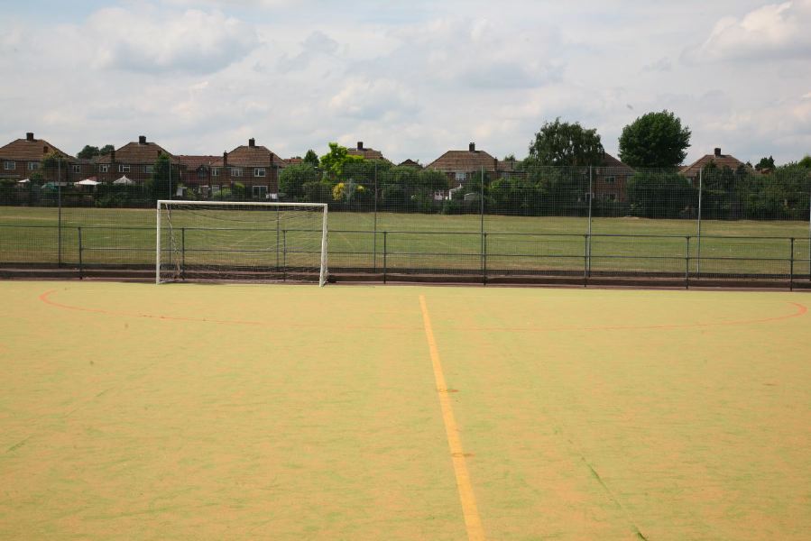 Astro pitches with a suburban backdrop
