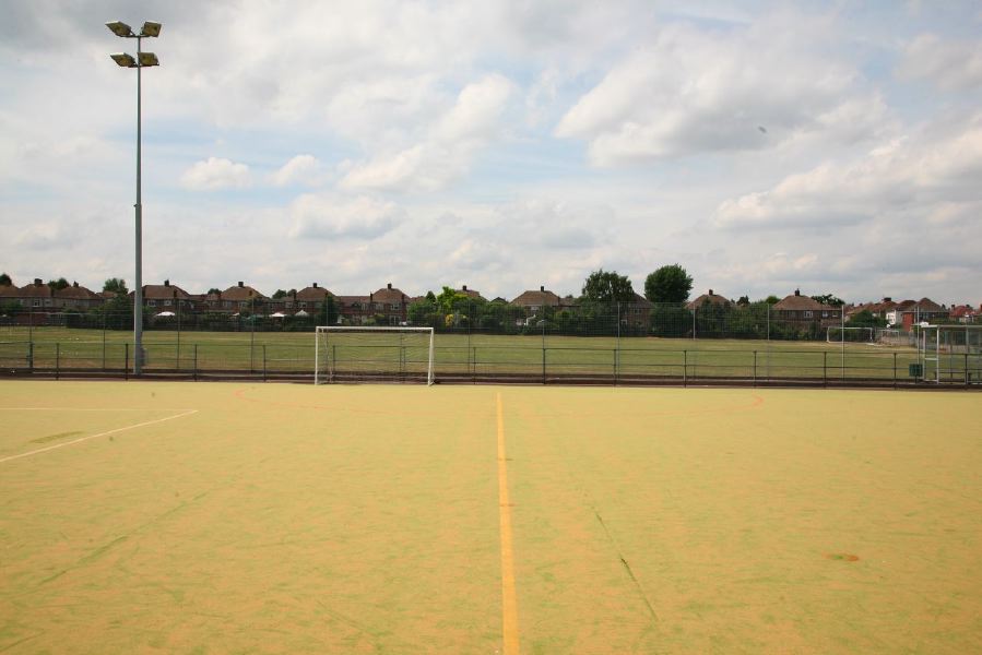 Astro pitches with a suburban backdrop