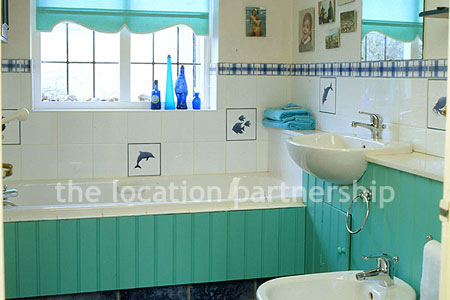 A large five bedroom cottage with a very Mediterranean exterior.