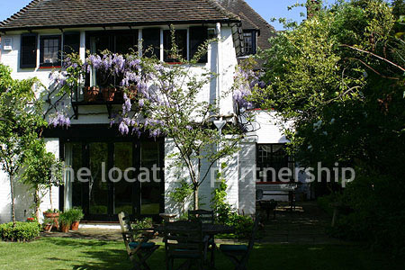 A large five bedroom cottage with a very Mediterranean exterior.