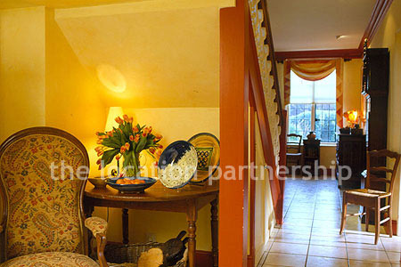 A large five bedroom cottage with a very Mediterranean exterior.