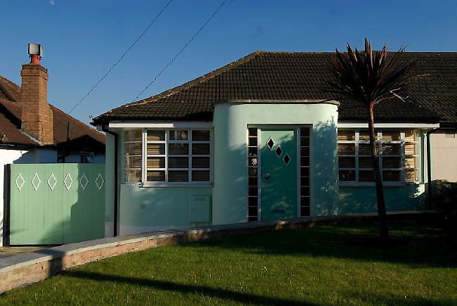 Pre-war bungalow renovated to give a Californian mid century Modern feel. The furnishings, fittings and decor are all authentic 40's. 50's. There is a large front and rear garden and long private driveway.