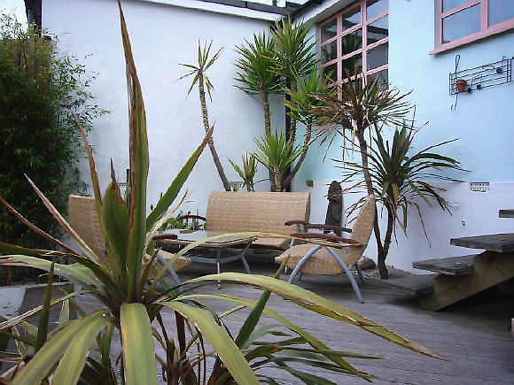 Pre-war bungalow renovated to give a Californian mid century Modern feel. The furnishings, fittings and decor are all authentic 40's. 50's. There is a large front and rear garden and long private driveway.
