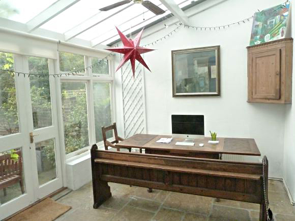 A semi-detached 5 bedroomed house with two reception rooms a conservatory and large back garden.