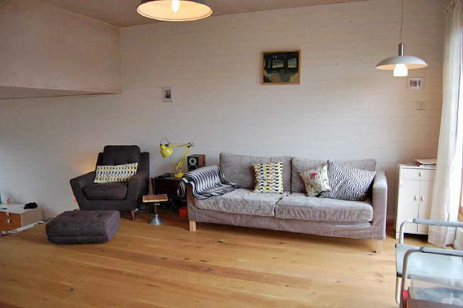 Modern terraced house built as a live/ work studio. Living space is split level with quirky details. Also features a roof terrace with views of the city/ East London.