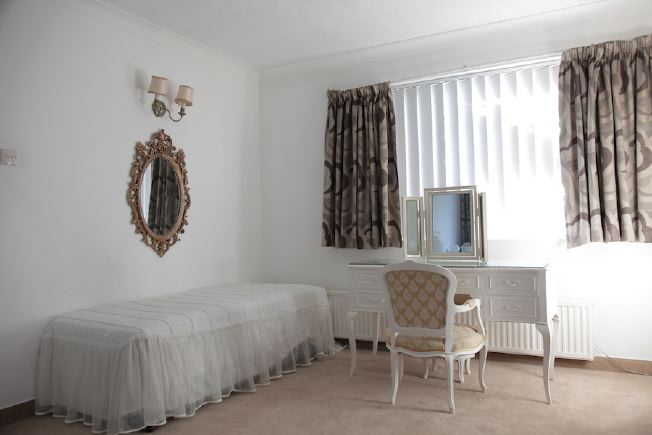 Stylised, neutral double bedroom at fantastic 70's house.